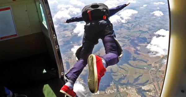 Person skydiving out of an airplane